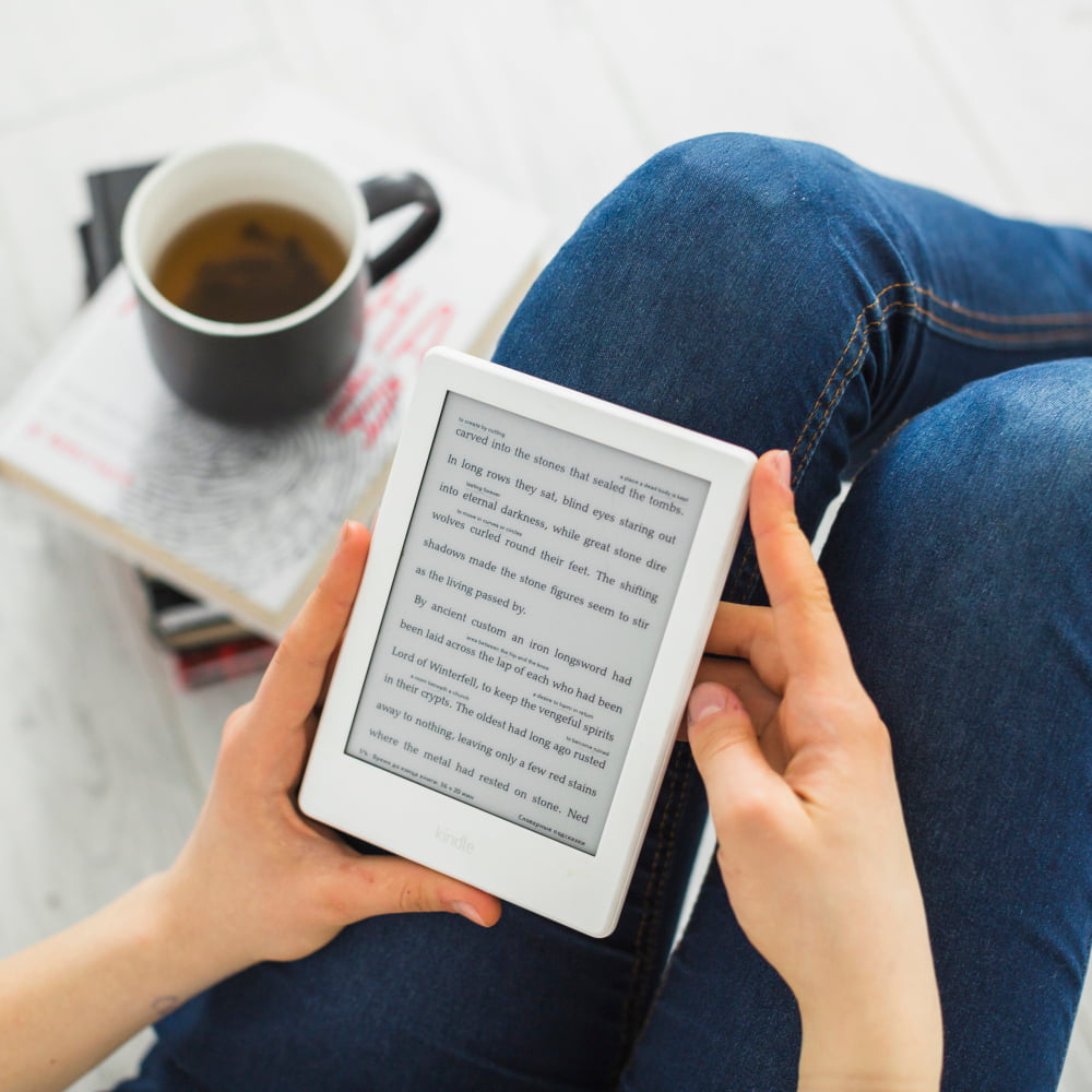 girl reading e-book on kindle