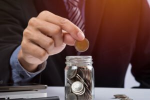 hand putting coins