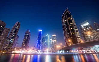 invest in dubai real estate business bay at night